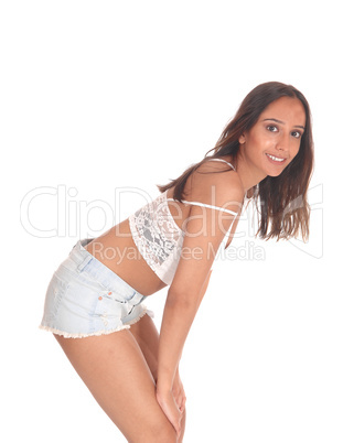 Woman in jeans shorts bending forwards