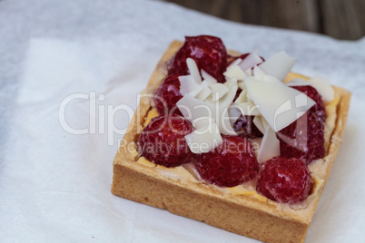 Red raspberry tart pastry with a cookie crust and white chocolat