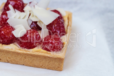 Red raspberry tart pastry with a cookie crust and white chocolat
