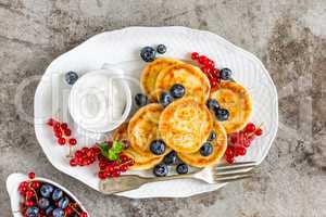 Cottage cheese fritters, pancakes with berries