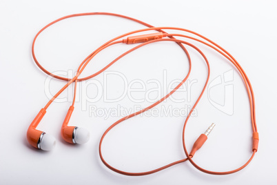 An orange used, stereo hands free set