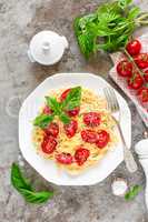 Spaghetti with tomatoes, basil and cheese