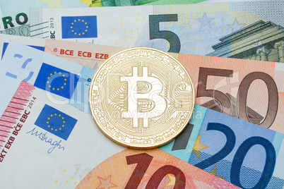 Close up of Silver Bitcoin on euro currency background. Conceptu