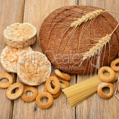 bread, pasta and pastries on wooden surface