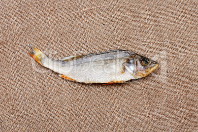 Dried fish on the  burlap close-up.