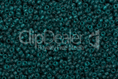 Blue-green seed beads background.