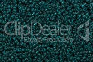 Blue-green seed beads background.