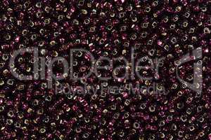 Background of black and red seed beads.