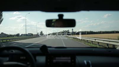 Driving car on freeway on summer day