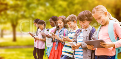 Composite image of smiling friends using technologies