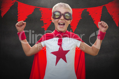 Composite image of little boy dressed as superman