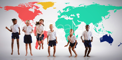 Composite image of happy students in school uniforms
