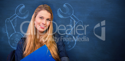 Composite image of pretty student in the library