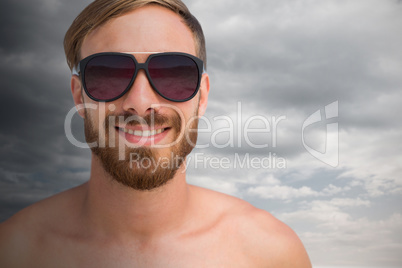 Composite image of portrait of handsome man wearing sunglasses