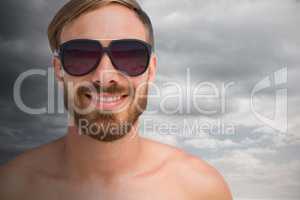 Composite image of portrait of handsome man wearing sunglasses