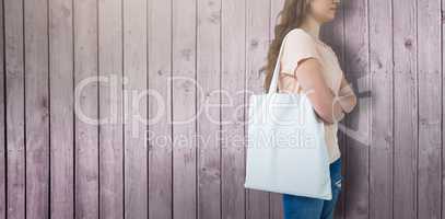 Composite image of women holding bag with blank space