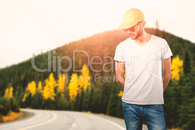 Composite image of model wearing cap and sunglasses against white background