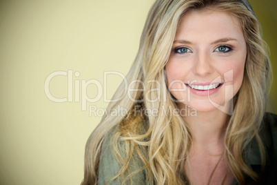 Composite image of close up portrait of smiling young blonde woman