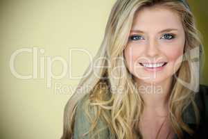 Composite image of close up portrait of smiling young blonde woman