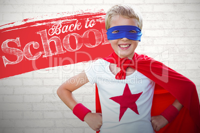 Composite image of portrait image of cheerful superhero boy