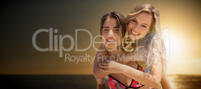 Composite image of friends hugging on the beach