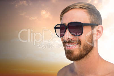 Composite image of fashionable man wearing sun glasses