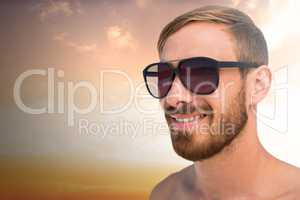 Composite image of fashionable man wearing sun glasses
