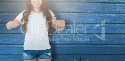 Composite image of midsection of female model pointing at self