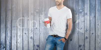 Composite image of handsome man posing with cup of coffee