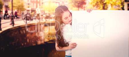 Composite image of women holding blank poster