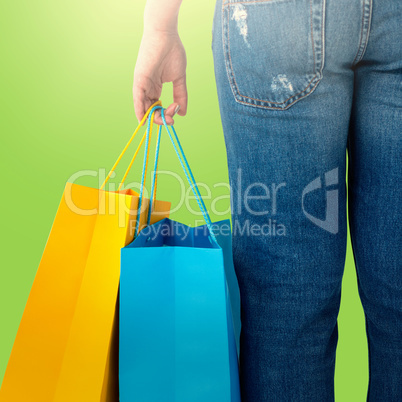 Composite image of beautiful brunette women holding bags