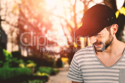 Composite image of handsome man wearing hat