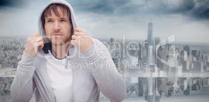 Composite image of portrait confident, cool young latino man wearing hoody