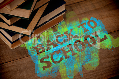 Composite image of back to school text on green and blue splash