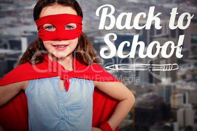 Composite image of little girl pretending to be a superhero