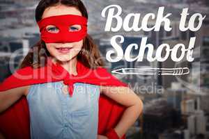 Composite image of little girl pretending to be a superhero