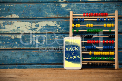 Composite image of digital composite image of back to school text on blue spray paint