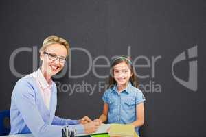 Composite image of portrait of teacher with student writing on book