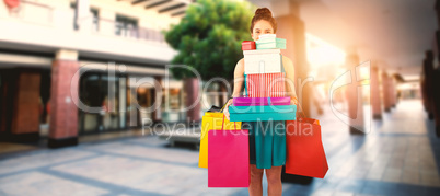 Composite image of women holding shopping bag