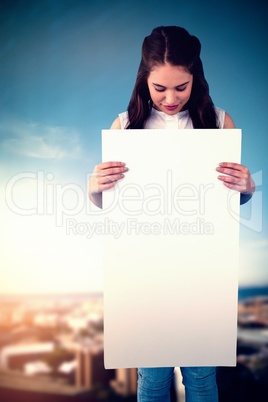 Composite image of women holding blank poster