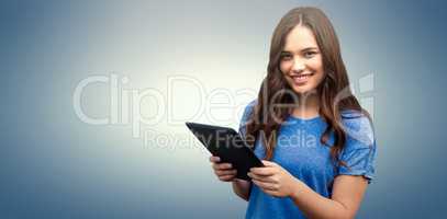 Composite image of brunette women holding tablet