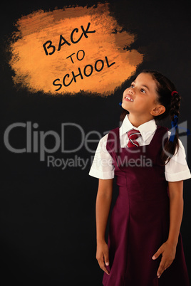 Composite image of digital composite image of back to school text on blue spray paint