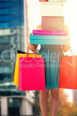 Composite image of pretty women holding shopping bags