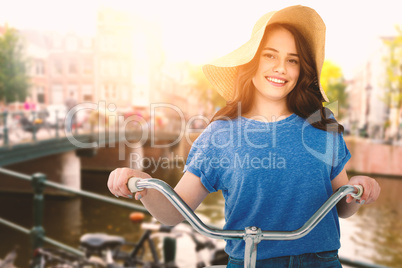 Composite image of smiling women riding bicycle