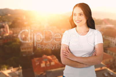 Composite image of smiling female model standing with arms crossed