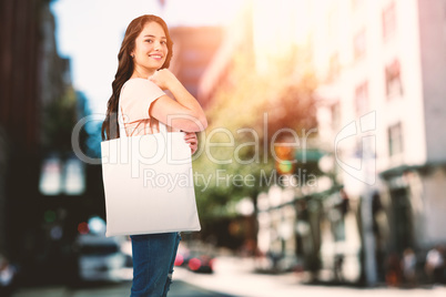 Composite image of beautiful brunette women holding bags