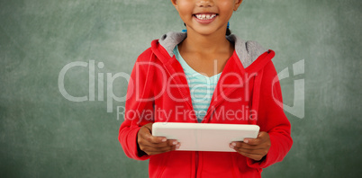 Young girl holding digital tablet