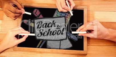Composite image of back to school text on paper with pen