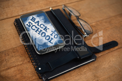 Composite image of back to school text on green and blue splash
