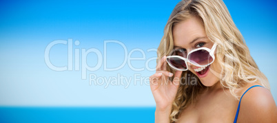 Composite image of portrait of young women wearing sunglasses